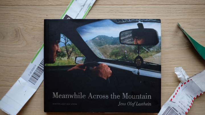 Jesse’s Book Review – “Meanwhile Across the Mountain” by Jens Olof Lasthein